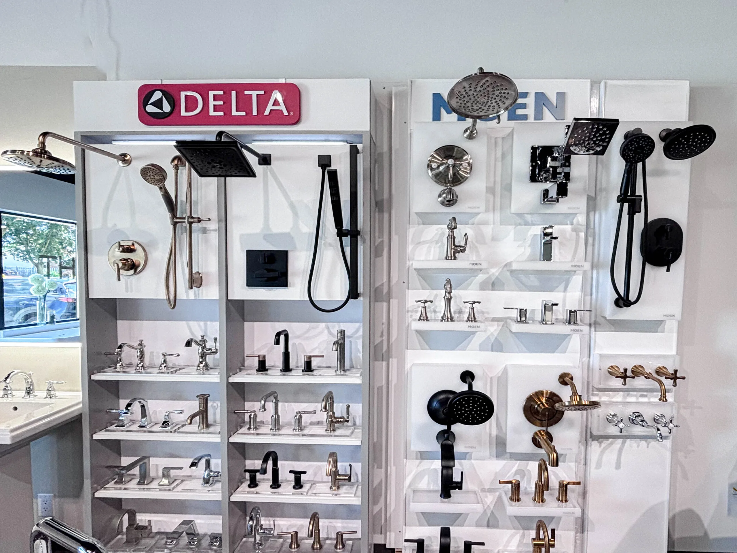 Delta and Moen shower and faucet displays in the showroom